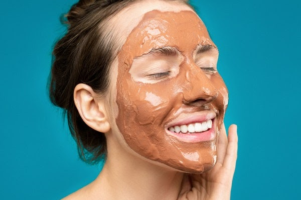  Woman with clay mask on her face