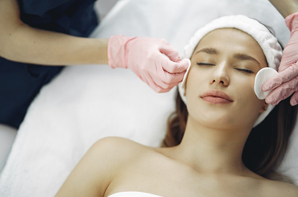 patient getting her skin prepped for a chemical peel