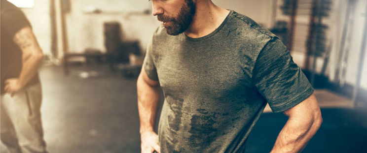 A man sweating through his shirt