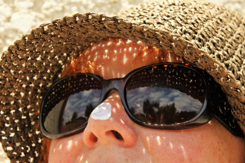  drop of sunscreen on a woman’s nose